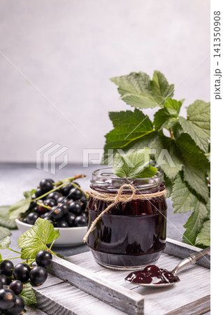 Homemade blackcurrant jam in a jar with fresh berries Homemade blackcurrant jam in a jar with fresh berries 141350908