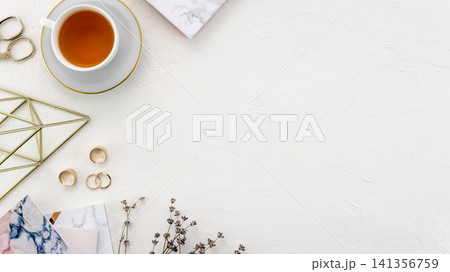 Tea Cup Flat Lay on White Textured Background with Jewelry Tea Cup Flat Lay on White Textured Background with Jewelry 141356759