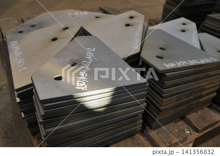 Stacked Steel Plates in Metal Fabrication Workshop 141356832