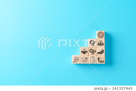 Business development strategy and planning concept. Wooden blocks stacked as steps with business icons including handshake, target, gears, rocket, growth charts. Symbol of progress, success strategy. Business development strategy and planning concept. Wooden blocks stacked as steps with business icons including handshake, target, gears, rocket, growth charts. Symbol of progress, success strategy. 141357443