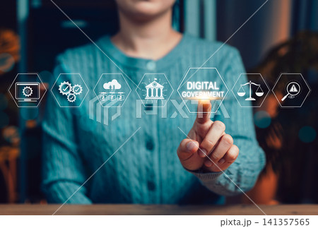 Digital government and E-governance concept. Person touching digital government icon representing e-government, smart governance, online services, digital transformation and secure data systems. Digital government and E-governance concept. Person touching digital government icon representing e-government, smart governance, online services, digital transformation and secure data systems. 141357565