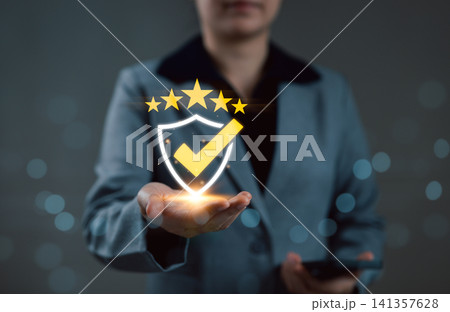 Quality Assurance and Compliance Certification Concept. Businesswoman presents glow shield icon with checkmark and five stars, symbolizing quality assurance, certification, and compliance verification Quality Assurance and Compliance Certification Concept. Businesswoman presents glow shield icon with checkmark and five stars, symbolizing quality assurance, certification, and compliance verification 141357628