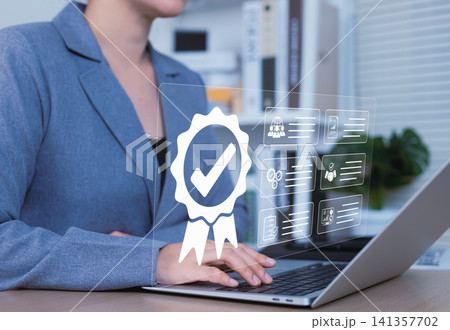 Quality Assurance and Certification Compliance Concept. Businesswoman using laptop with icons representing quality assurance, certification, compliance standards, and performance assessment. ISO, Quality Assurance and Certification Compliance Concept. Businesswoman using laptop with icons representing quality assurance, certification, compliance standards, and performance assessment. ISO, 141357702