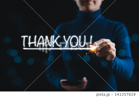 Thank You Message and Business Appreciation Concept. Woman draws text THANK YOU! in air, representing gratitude, congratulations, and professional appreciation in business or customer service context. Thank You Message and Business Appreciation Concept. Woman draws text THANK YOU! in air, representing gratitude, congratulations, and professional appreciation in business or customer service context. 141357819
