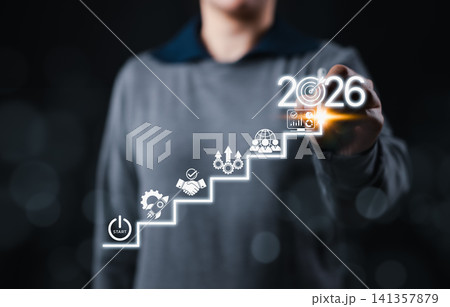 Business strategy and growth roadmap concept with person pointing at 2026, visualizing success steps from startup to achievement using icons for planning, teamwork, process and successful goals. 141357879