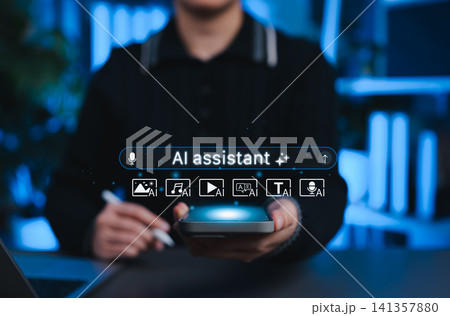 AI assistant technology concept. User holding smartphone with glowing interface and AI assistant icons for image, music, video, translation, text, voice generation, representing creative AI tool usage AI assistant technology concept. User holding smartphone with glowing interface and AI assistant icons for image, music, video, translation, text, voice generation, representing creative AI tool usage 141357880