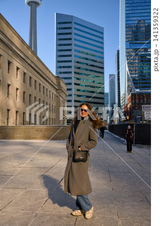 Woman In Coat Stands Before Historic Toronto Building Canada  141359322