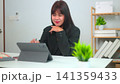 young business woman working in the office 141359433