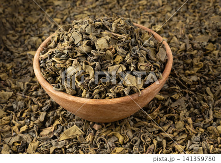 Green tea leaves macro textured background 141359780