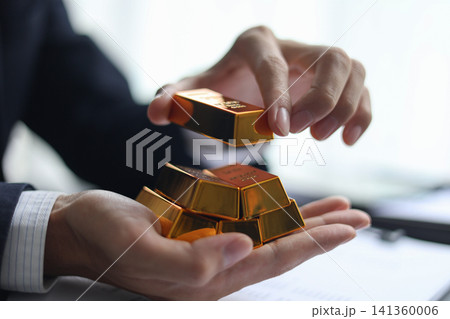 Gold investment. Strategic wealth management and secure gold commodity trading concept Gold investment. Strategic wealth management and secure gold commodity trading concept 141360006