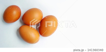 Top-down view of four fresh brown eggs with empty space. Top-down view of four fresh brown eggs with empty space. 141360340