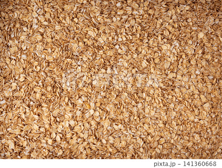 Oat flakes textured pattern, rolled oatmeal macro background 141360668
