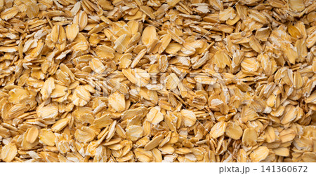 Oat flakes textured pattern, rolled oatmeal macro background Oat flakes textured pattern, rolled oatmeal macro background 141360672