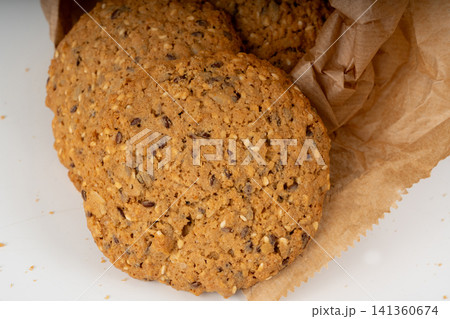 Whole and broken oatmeal cookies, cereal biscuits, fitness bakery Whole and broken oatmeal cookies, cereal biscuits, fitness bakery 141360674