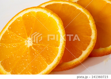 Orange fruit slice macro textured background 141360723
