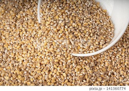 Pearl barley grains textured background 141360774