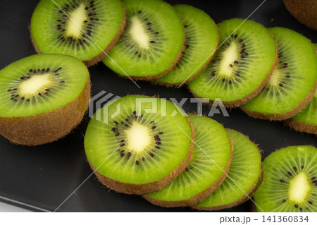 Kiwi fruit pattern, green kiwifruit slice texture Kiwi fruit pattern, green kiwifruit slice texture 141360834