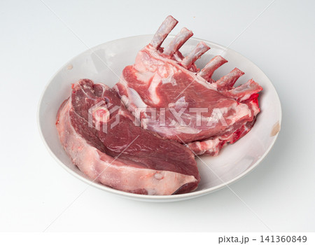 Raw lamb rack isolated, fresh mutton fillet with ribs, tenderloin pieces, mutton rump sirloin meat 141360849
