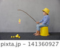 Happy child playing indoor. Kid enjoying a fishing trip. Little boy having fun at home 141360927