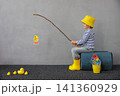 Happy child playing indoor. Kid enjoying a fishing trip. Little boy having fun at home 141360929