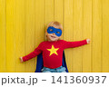 Little boy dressed as a superhero having fun at home 141360937