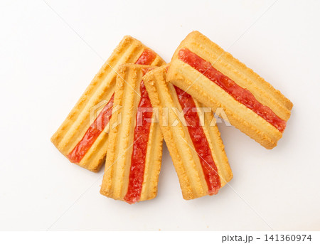 Shortbread sticks with a jam strip isolated, biscuit cookies with fruit marmalade or jelly on white Shortbread sticks with a jam strip isolated, biscuit cookies with fruit marmalade or jelly on white 141360974