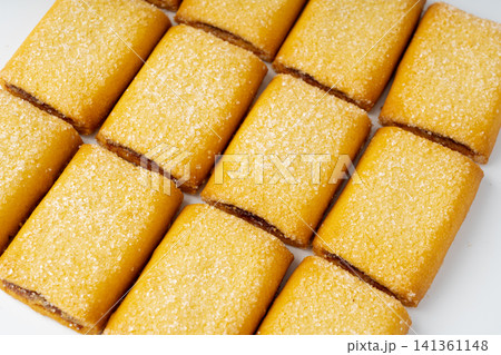 Fig roll bar, square sugar cookies with fruit filling 141361148