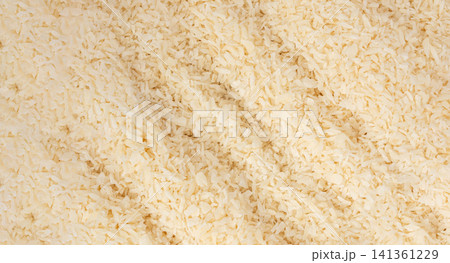 Grated coconut powder. Dry coco flakes pile, shredded desiccated coconut, tropical fruit chips Grated coconut powder. Dry coco flakes pile, shredded desiccated coconut, tropical fruit chips 141361229