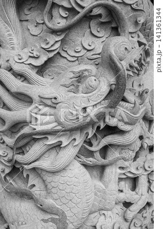 Element of a bas-relief on the wall of a Buddhist monastery Element of a bas-relief on the wall of a Buddhist monastery 141361344