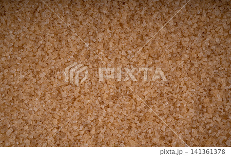 Brown cane sugar pile textured background top view Brown cane sugar pile textured background top view 141361378