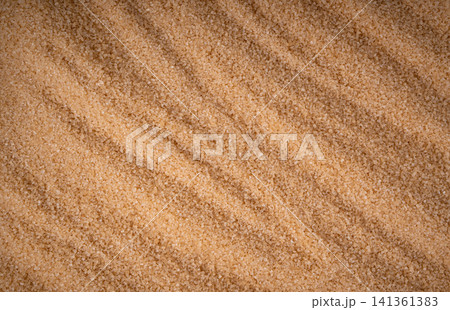 Brown cane sugar pile textured background top view Brown cane sugar pile textured background top view 141361383
