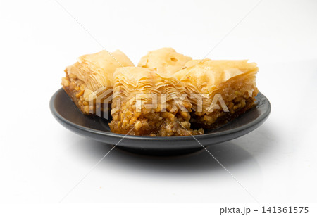 Baklava Isolated, Small Ramadan Dessert, Eastern Sweet Filo Pastries, Turkish Honey Baklawa, Oriental Desert Baklava Isolated, Small Ramadan Dessert, Eastern Sweet Filo Pastries, Turkish Honey Baklawa, Oriental Desert 141361575