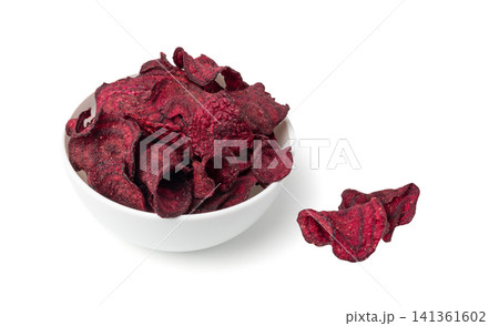 Dry beetroot chips isolated, dried sliced red beet flakes pile, beet root pieces and chips Dry beetroot chips isolated, dried sliced red beet flakes pile, beet root pieces and chips 141361602