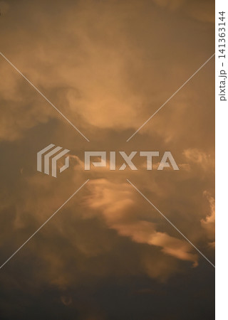 Beautiful orange sky creating a warm natural atmosphere, with intense colors and soft light typical of sunset or sunrise. Beautiful orange sky creating a warm natural atmosphere, with intense colors and soft light typical of sunset or sunrise. 141363144