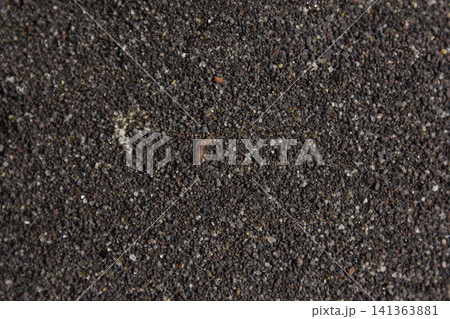 This is a close-up of black sand. This is a close-up of black sand. 141363881