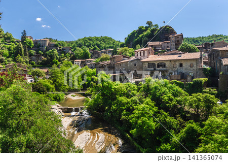 Panoramic view of Rupit medieval village in Catalonia, Spain, with historic stone houses, lush green forest 141365074