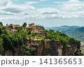 Stone houses of Siurana standing atop dramatic cliffs above the Catalan mountains, panoramic view 141365653