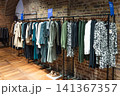 Clothing on racks in a fashion boutique store 141367357