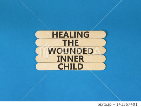 Healing the wounded inner child symbol. Concept words Healing the wounded inner child on beautiful wooden sticks. Beautiful blue background. Psychological Healing inner child concept. Copy space. Healing the wounded inner child symbol. Concept words Healing the wounded inner child on beautiful wooden sticks. Beautiful blue background. Psychological Healing inner child concept. Copy space. 141367401