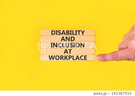 Disability and inclusion symbol. Concept words Disability and inclusion at workplace on beautiful wooden sticks. Beautiful yellow background. Disability and inclusion at workplace concept. Copy space. Disability and inclusion symbol. Concept words Disability and inclusion at workplace on beautiful wooden sticks. Beautiful yellow background. Disability and inclusion at workplace concept. Copy space. 141367553