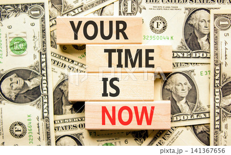 Your time is now words symbol. Concept words Your time is now on beautiful wooden blocks. Beautiful dollar bills background. Business support motivational your time is now concept. Copy space. Your time is now words symbol. Concept words Your time is now on beautiful wooden blocks. Beautiful dollar bills background. Business support motivational your time is now concept. Copy space. 141367656