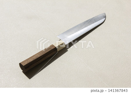 It is a kitchen knife placed against a white background. It is a kitchen knife placed against a white background. 141367843
