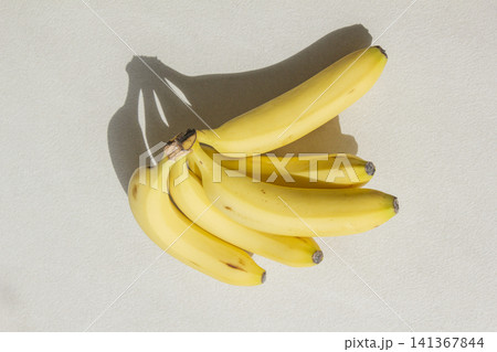 It is a banana placed on a white background. It is a banana placed on a white background. 141367844