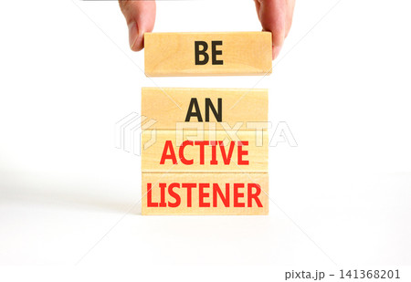Be an active listener words symbol. Concept words Be an active listener on beautiful wooden blocks. Beautiful white background. Businessman hand. Business be an active listener concept. Copy space. Be an active listener words symbol. Concept words Be an active listener on beautiful wooden blocks. Beautiful white background. Businessman hand. Business be an active listener concept. Copy space. 141368201
