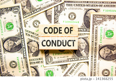 Code of conduct words symbol. Concept words Code of conduct on beautiful wooden blocks. Beautiful dollar bills background. Dollar bills. Business Code of conduct concept. Copy space. Code of conduct words symbol. Concept words Code of conduct on beautiful wooden blocks. Beautiful dollar bills background. Dollar bills. Business Code of conduct concept. Copy space. 141368255