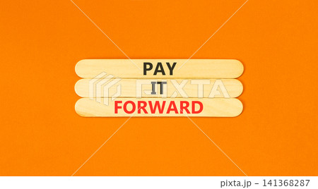 Pay it forward words symbol. Concept words Pay it forward on beautiful wooden sticks. Beautiful orange background. Business and pay it forward concept. Copy space. 141368287
