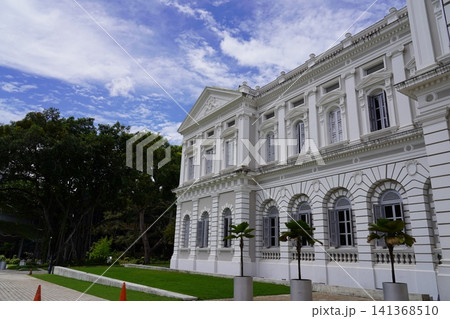 Historic White Building with Banyan Tree and Palm Plants Historic White Building with Banyan Tree and Palm Plants 141368510
