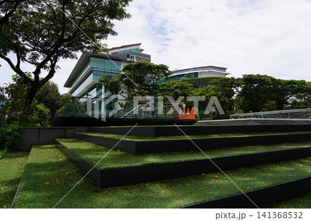 Contemporary university building surrounded by trees Contemporary university building surrounded by trees 141368532