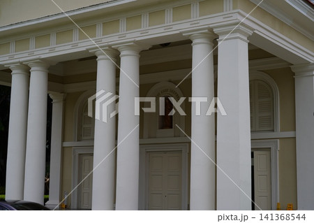 Grand Building with Neoclassical Columns and Religious Art 141368544