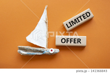 Limited offer symbol. Concept word Limited offer on wooden blocks. Beautiful orange background with boat. Business and Limited offer concept. Copy space Limited offer symbol. Concept word Limited offer on wooden blocks. Beautiful orange background with boat. Business and Limited offer concept. Copy space 141368843